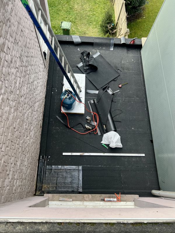 Flat Roof Repair After Storm Or Wind Damage