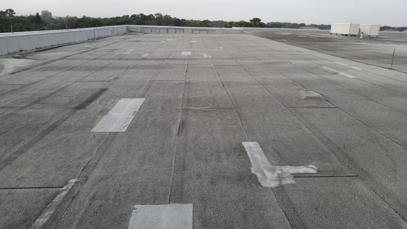 Flat Roof Repair After Storm Or Wind Damage